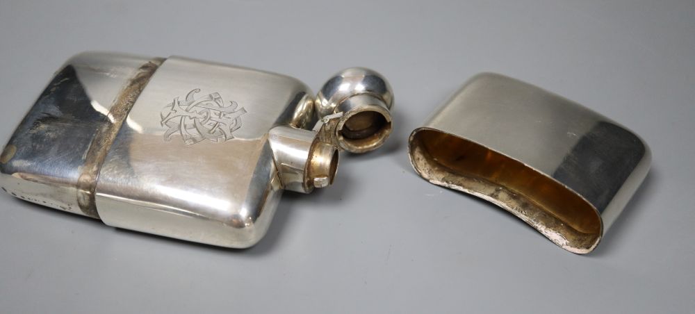 A late Victorian silver hip flask, Deakin & Francis, Birmingham, 1900, 12.9cm, gross 189 grams, with engraved monogram.